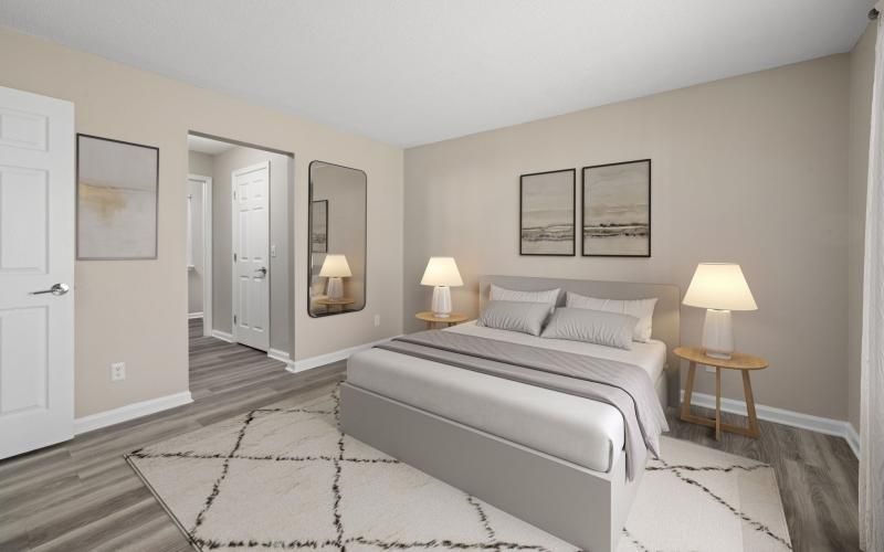 a bedroom with a bed and lamps