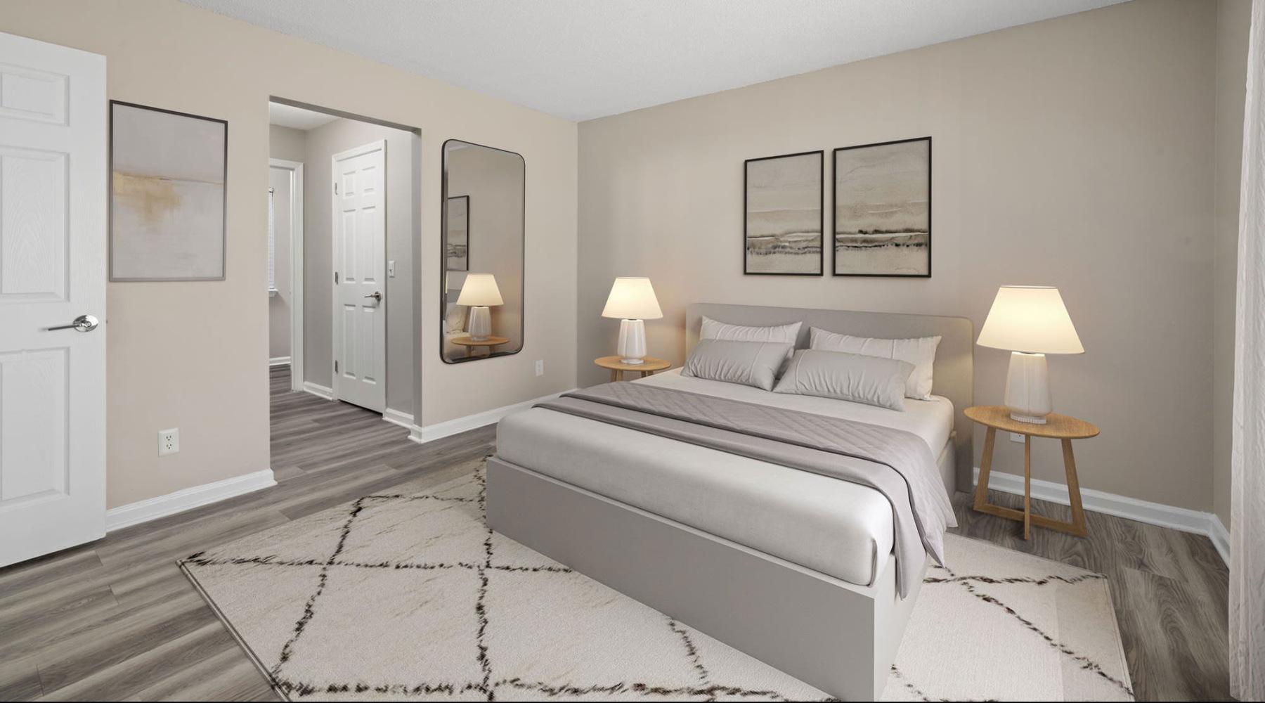 a bedroom with a bed and lamps